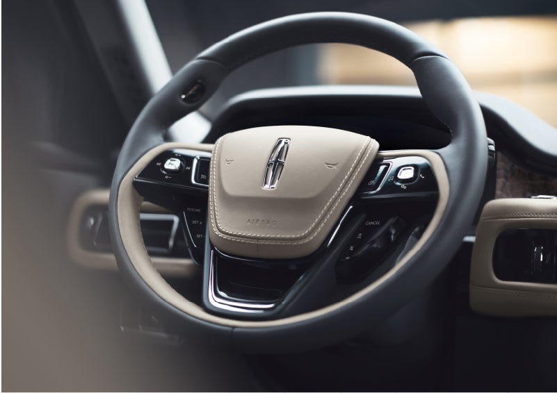 The intuitively placed controls of the steering wheel on a 2023 Lincoln Aviator® SUV | Capital Lincoln of Wilmington in Wilmington NC