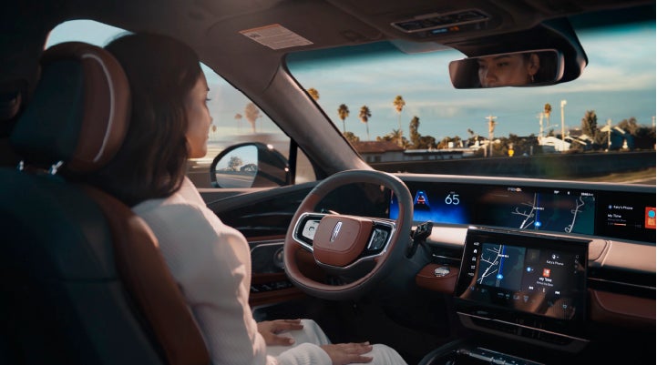 A person is shown driving hands-free on the highway with available Lincoln BlueCruise technology. | Capital Lincoln of Wilmington in Wilmington NC